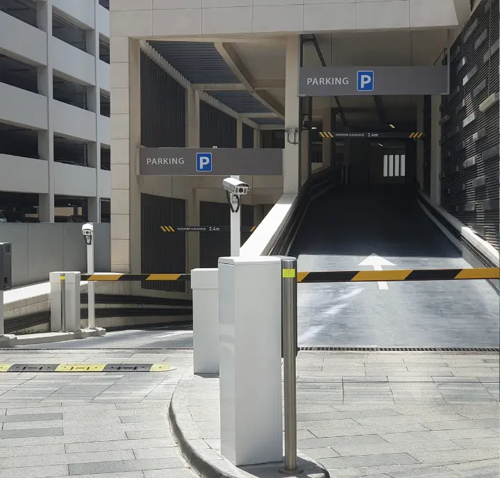 Secure parking garage entrance with barrier