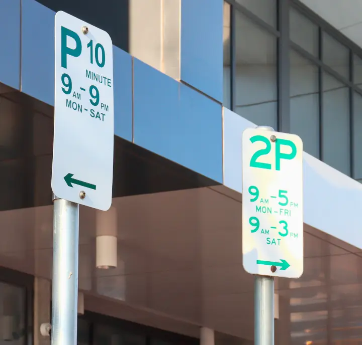 Parking signs showing time limits and restrictions