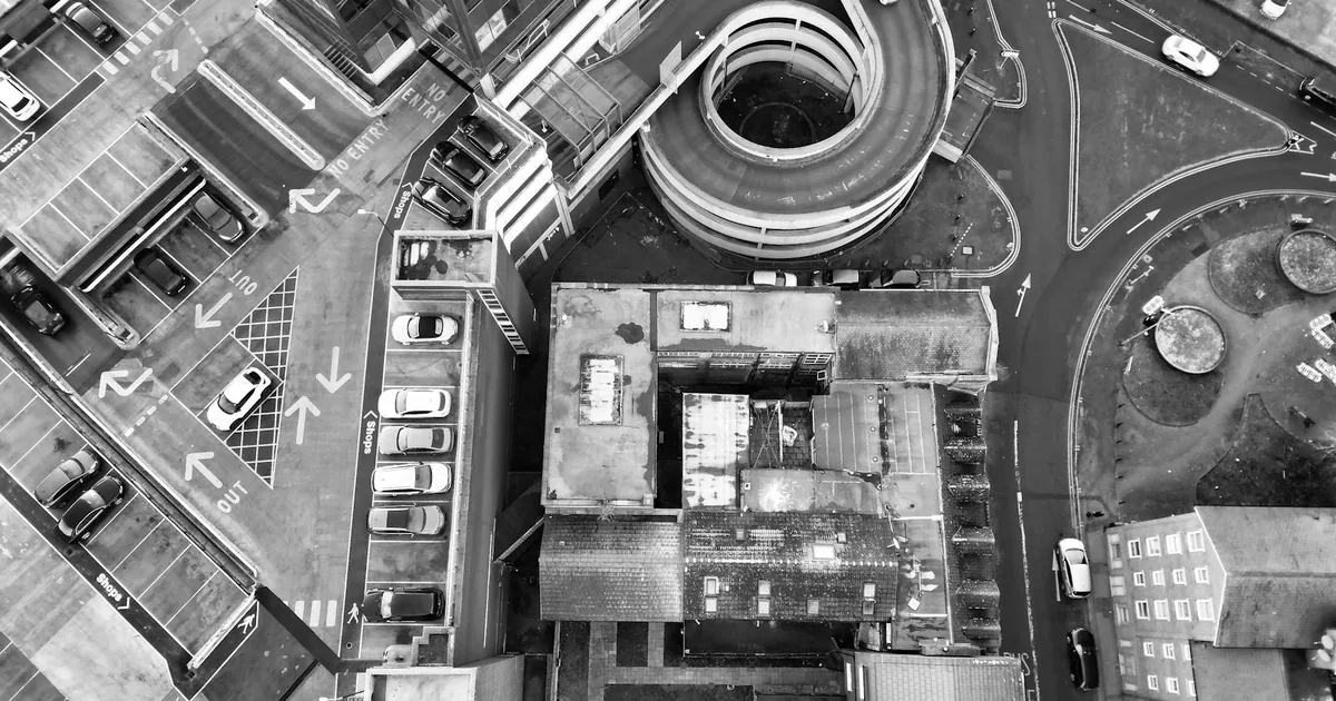 Aerial view of a multi level parking structure and surrounding.