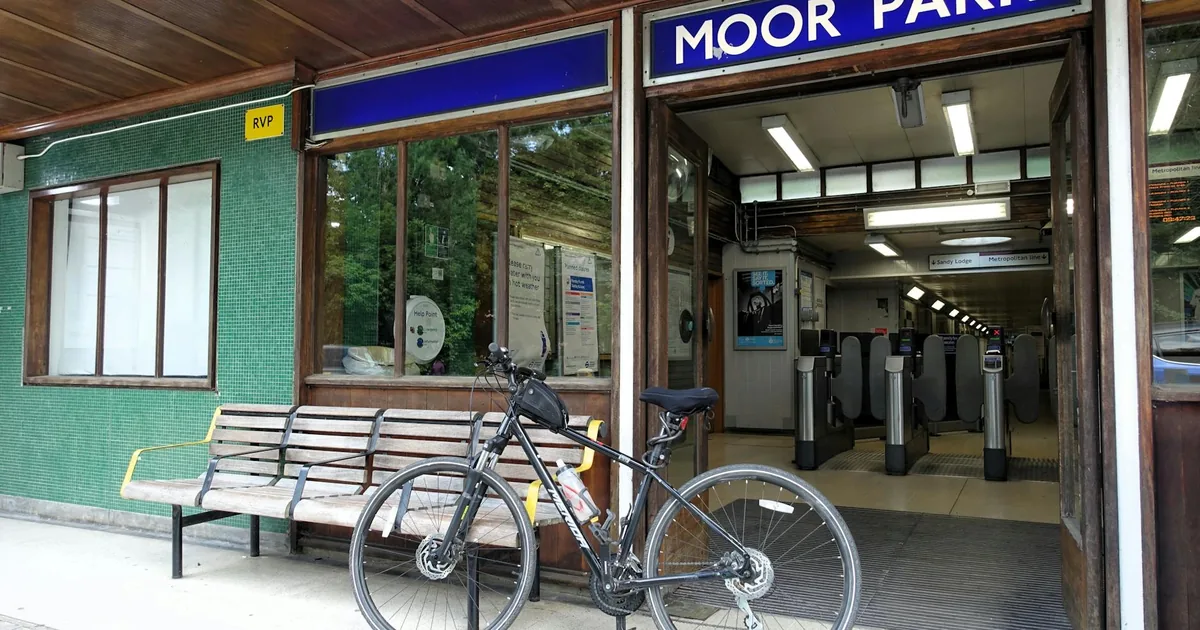 Entrance to a parking facility with a bicycle parked outside.